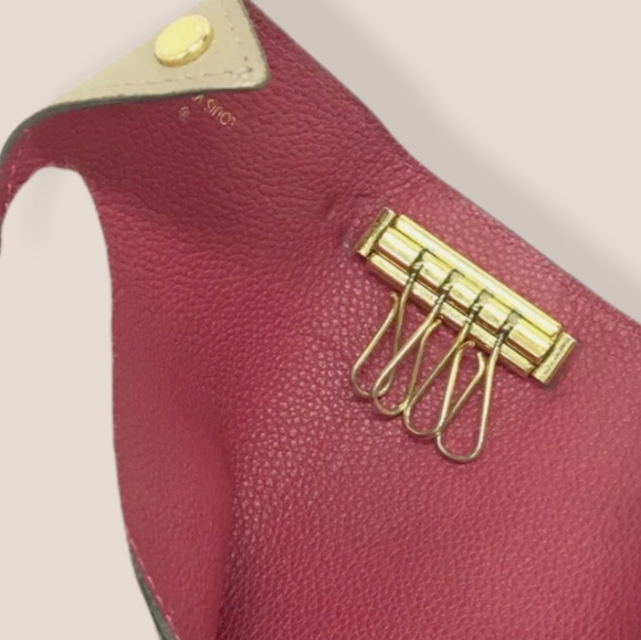 LOUIS  VUITTON  Clemence Leather 4 Ring K… - Picture 9 of 15